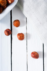 hard shell stone fruits on white wood table background