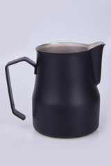 Black Metal pitcher for coffee making. Barista tool. Milk pitcher. Set  of pithers. Isolated