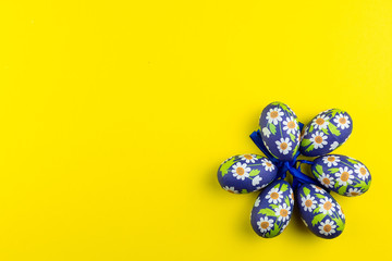 Easter eggs on yellow background