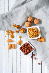 hard shell stone fruits on white wood table background
