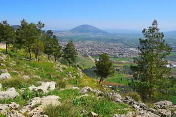 views of the Jezreel Valley and Mount Tabor from the heights of Mount Precipice, located just outside the southern edge of Nazareth, Lower Galilee, Israel