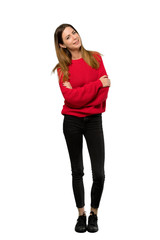 A full-length shot of a Young woman with red sweater Happy and smiling over isolated white background