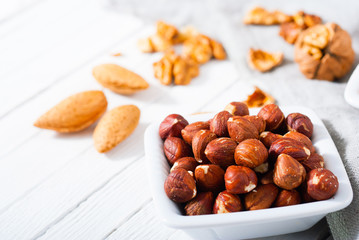 hard shell stone fruits on white wood table background