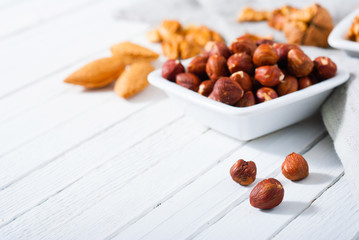 hard shell stone fruits on white wood table background