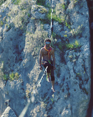 Man balancing on the rope concept of risk taking and challenge.