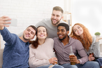 Happy friends enjoying time together and making selfie
