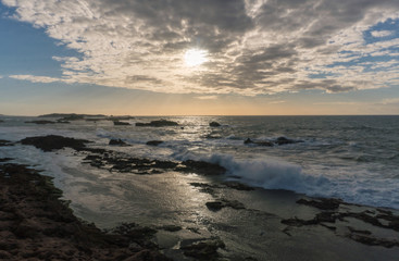 Obraz premium Sunset Over the Rocks of Atlantic Ocean in Morocco at Low Tide