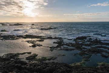 Sunset Over the Rocks of Atlantic Ocean in Morocco at Low Tide