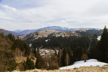 Fototapeta premium Spring vs winter landscape in the Carpathian mountains