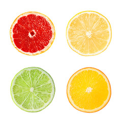 Set with slices of different fresh ripe citrus fruits on white background, top view