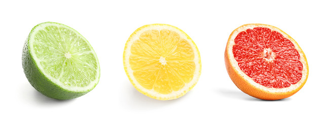 Set of fresh cut ripe citrus fruits on white background