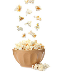 Bowl with delicious fresh popcorn on white background