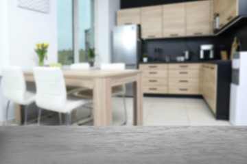 Empty table in modern kitchen. Mockup for design