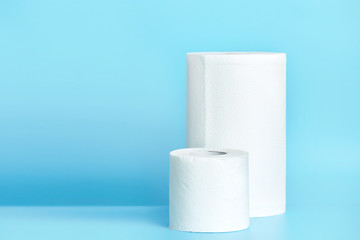 Toilet paper litchen towel on empty space blue background.