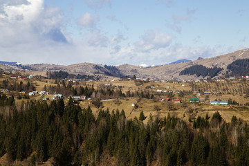 Fototapeta na wymiar Spring landscape in ancient hutsul village Holovy, near Carpathian mountains