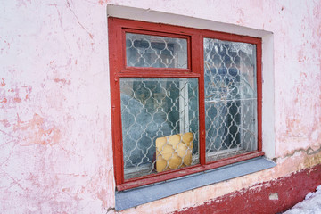 partially broken window in a residential building