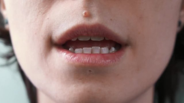 girl's mouth saying "I love you" close up