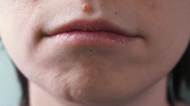 girl's mouth saying "I'm sorry" close up