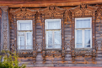 windows in a wooden house with platbands