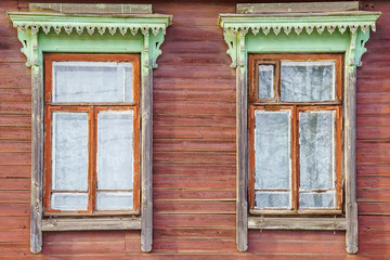 Obraz premium windows in a wooden house with platbands