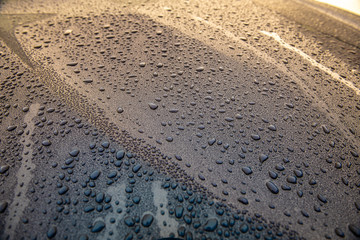 raindrops on blue glass surface