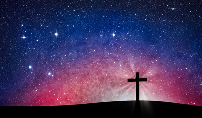 Silhouette cross on Calvary mountain-  Stars background. Easter concept