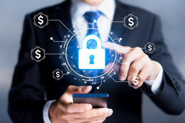 Financial security concept. Businessmen press the lock icon to protect the security of financial...