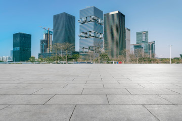 Urban skyscrapers with empty square floor tiles
