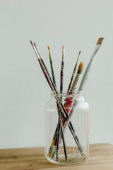 set of brushes in a vase isolated on white