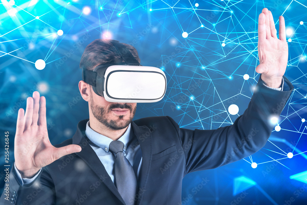 Wall mural businessman in vr glasses, blue network interface