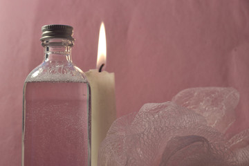 Pink bubble bath and candle