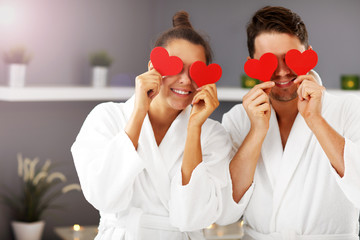 Adult happy couple relaxing in spa salon