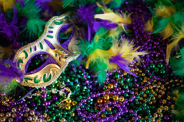 mardi gras mask, beads and feathers decor background - obrazy, fototapety, plakaty