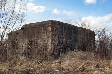 Destroyed soviet bunker, pillbox. Reinforced concrete defensive military structure. Molotov system of border fortified regions