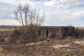 Destroyed soviet bunker, pillbox. Reinforced concrete defensive military structure. Molotov system of border fortified regions