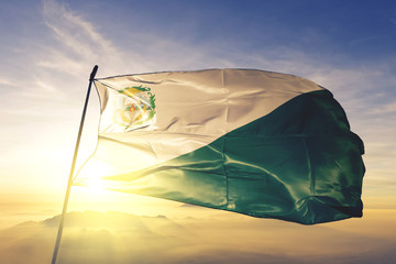 Chiquimula department of Guatemala flag waving on the top sunrise mist fog