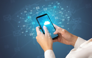 Female hand using smartphone with cloud, message and global concept
