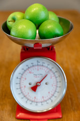 green apples in red scales