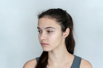 Fototapeta premium portrait of a young teen girl with indifference looking to the side