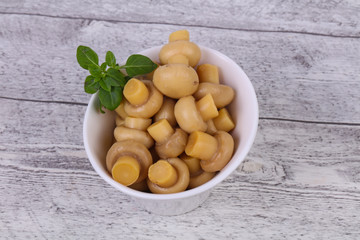Pickled champignon heap in the bowl