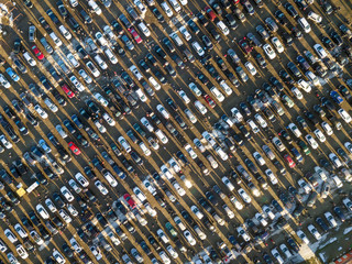 Aerial drone image of many cars parked on parking lot, top view.