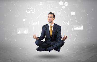 Elegant calm businessman levitates in yoga position with data circulation concept
