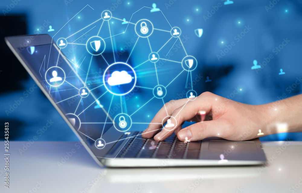 Aufkleber Hand using laptop with centralized cloud computing system and network security concept
