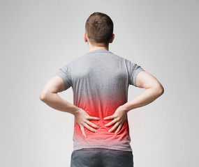 Man holding his hands behind his back