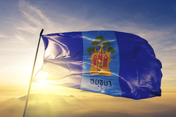 Phra Nakhon Si Ayutthaya province of Thailand flag waving sunrise mist fog