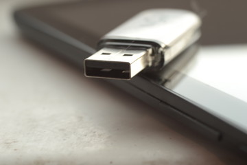 USB drive resting on tablet