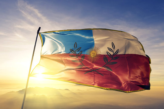 Catamarca province of Argentina flag waving on the top sunrise mist fog