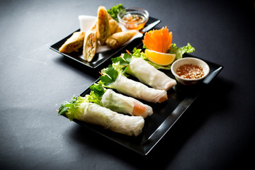 Spring rolls with vegetables in noodle tube. Vegetables in rice noodle tube