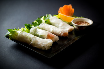Spring rolls with vegetables in noodle tube. Vegetables in rice noodle tube