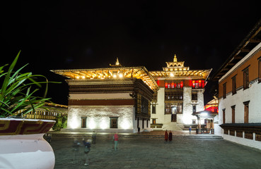 Fototapeta premium Tashichho Dzong at night, Thimphu, Bhutan Towers topped by triple-tiered golden roofs. The central Tower is called Utse.